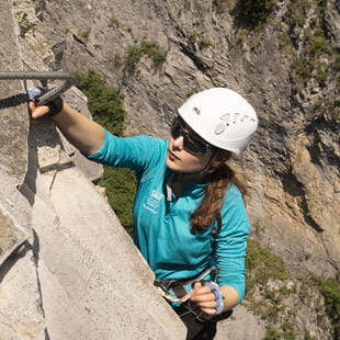 A student rock climbing