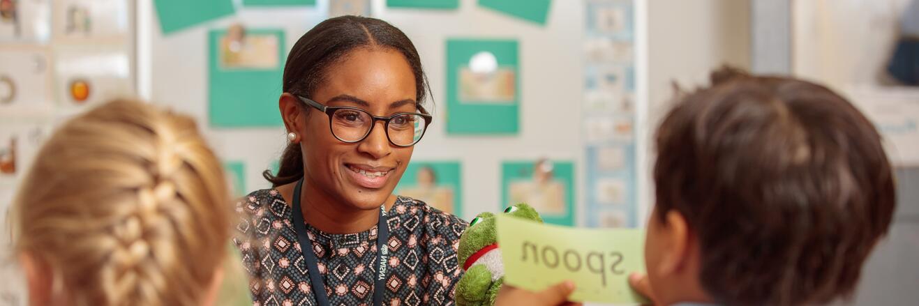 Teacher engaging in a lesson with two students