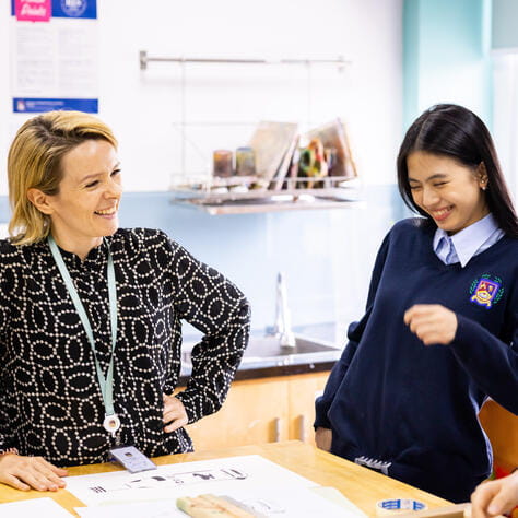 teacher and student studying the english national curriculum