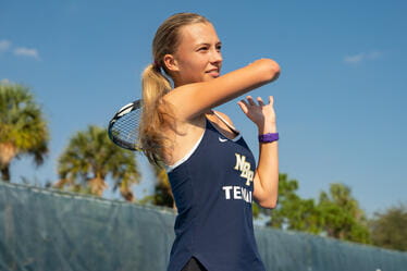 Student playing Tennis